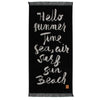Greenwich Polo Club 3641 black cotton beach towel with sand lettering, decorative fringes and “Hello Summertime” design.