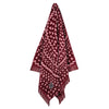 Hanging Greenwich Polo Club 3771 burgundy and ecru ethnic-pattern cotton beach towel with fringed ends.