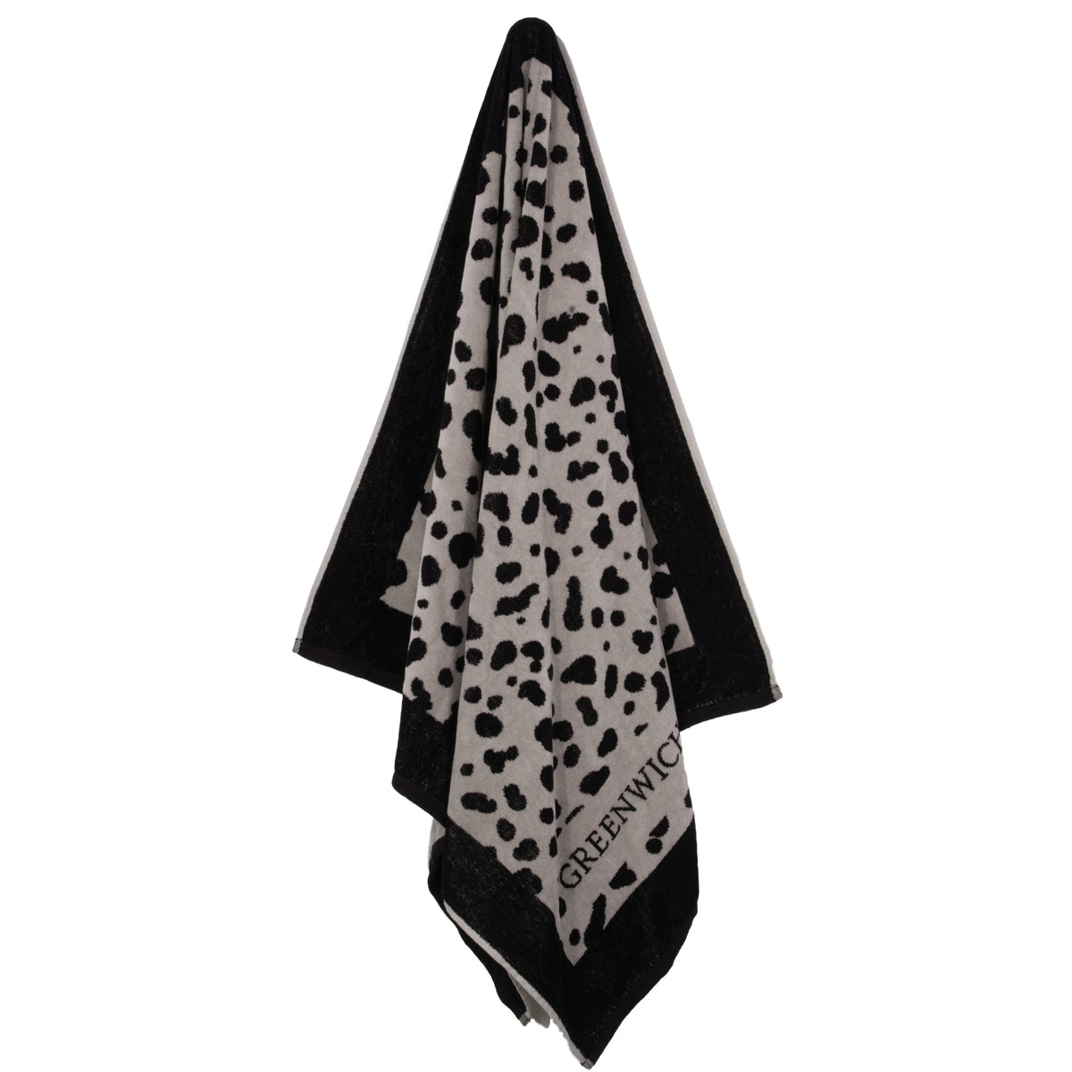 Hanging Greenwich Polo Club 5237 black and taupe animal-print cotton beach towel with fringed ends.