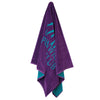Hanging view of Greenwich Polo Club beach towel 3784 in purple with an oversized turquoise logo, 90 × 170 cm.