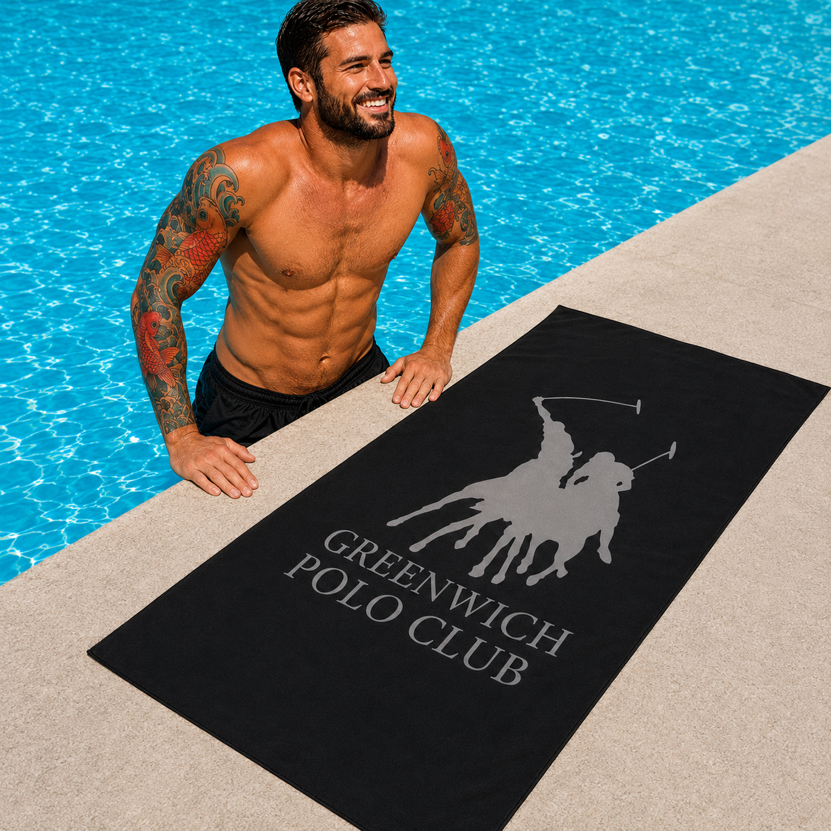 Greenwich Polo Club black microfiber beach towel 5214 with grey logo by luxury pool in Sitia Crete, available at VVC SHOP Sitia and viktoria-vigh.com