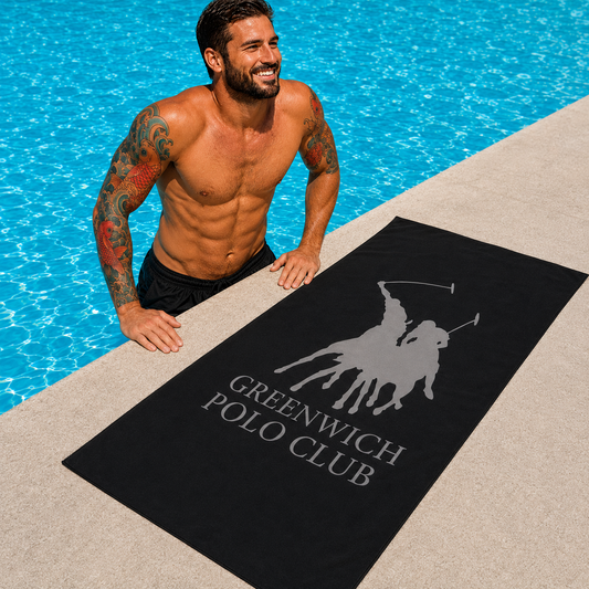 Greenwich Polo Club black microfiber beach towel 5214 with grey logo by luxury pool in Sitia Crete, available at VVC SHOP Sitia and viktoria-vigh.com
