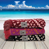 Folded Greenwich Polo Club ethnic-pattern beach towels in burgundy, grey and black colour options.