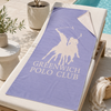 Greenwich Polo Club lavender microfiber beach towel 5215 displayed poolside in Crete for VVC SHOP Sitia.