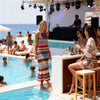 Side view of handmade crochet maxi dress with colorful pattern and open side design, perfect for beach parties.