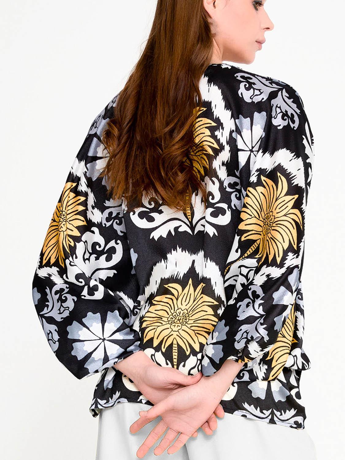Back view of silk-touch Imza palm print blouse showing airy batwing sleeves, loose fit shape and hot weather summer styling