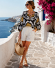 Loose fit palm tree blouse by Imza with black base, yellow grey and white print, airy batwing sleeves and tie neckline, available at VVC SHOP Sitia and online