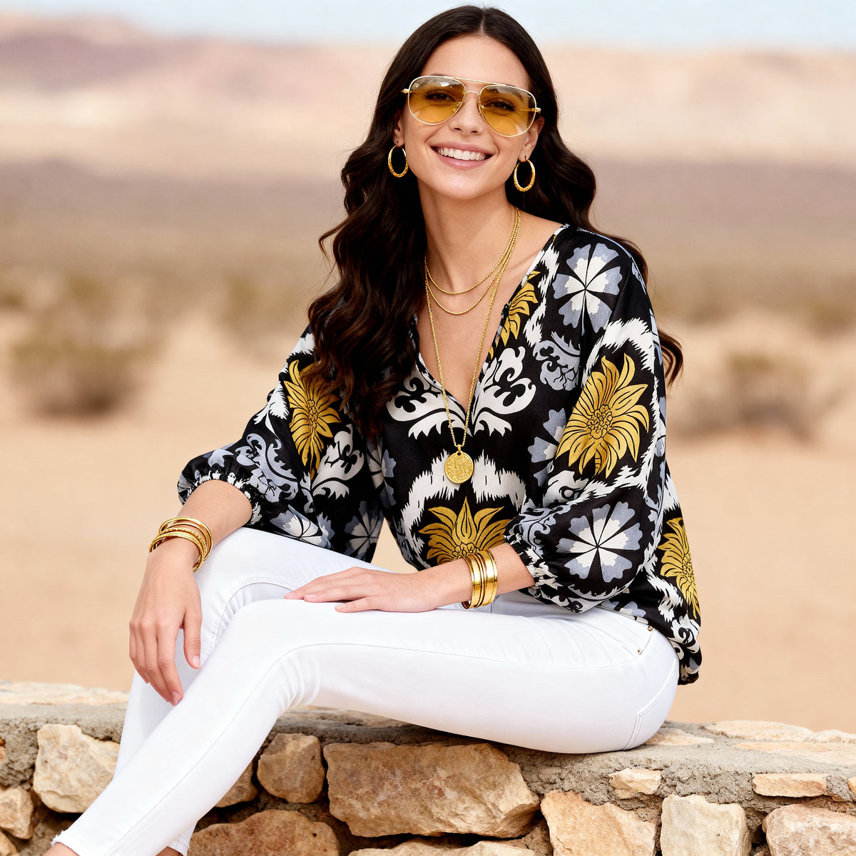 Imza loose fit palm tree summer blouse in black yellow grey and white styled with white trousers for hot weather travel and resort looks in Sitia Crete