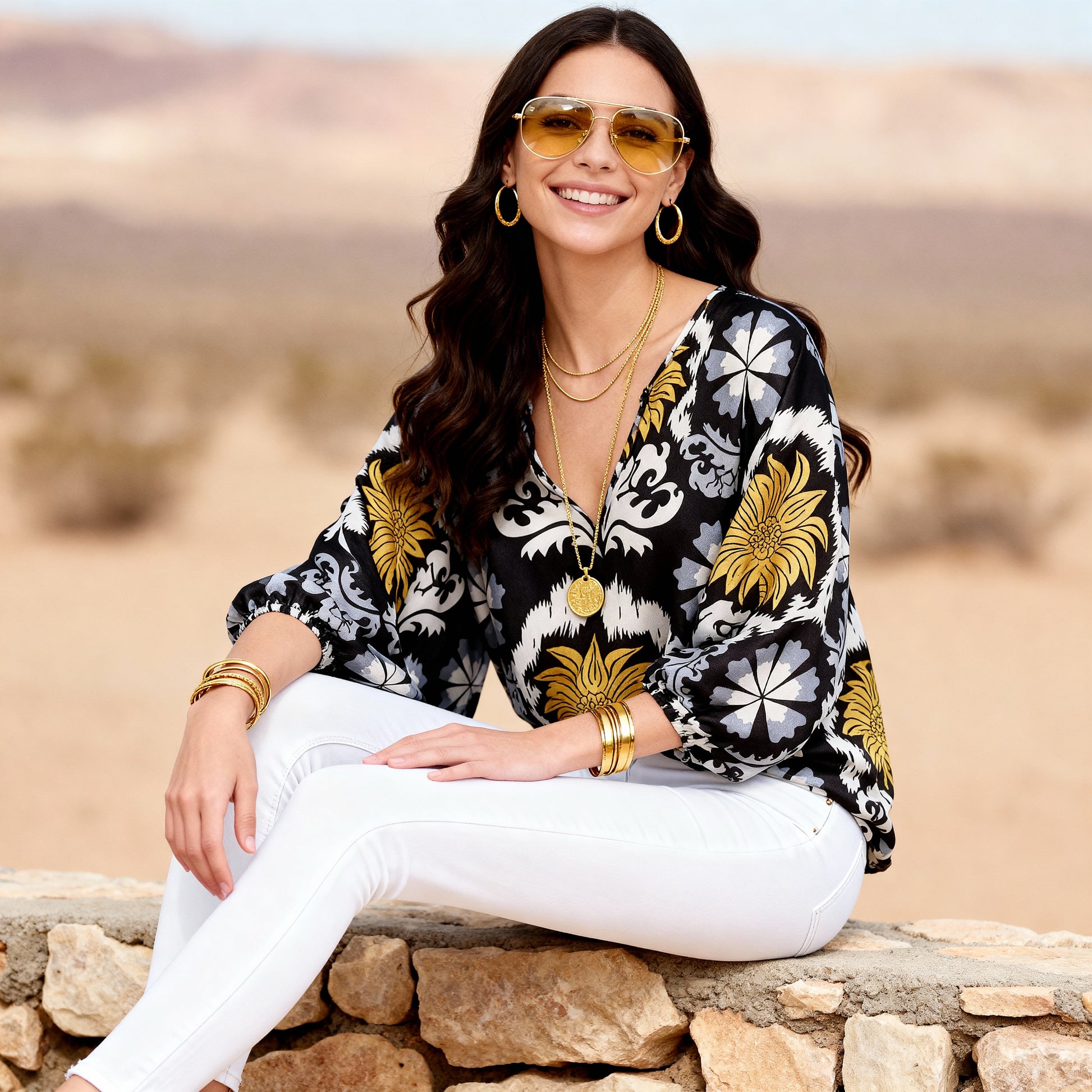 Imza loose fit palm tree summer blouse in black yellow grey and white styled with white trousers for hot weather travel and resort looks in Sitia Crete