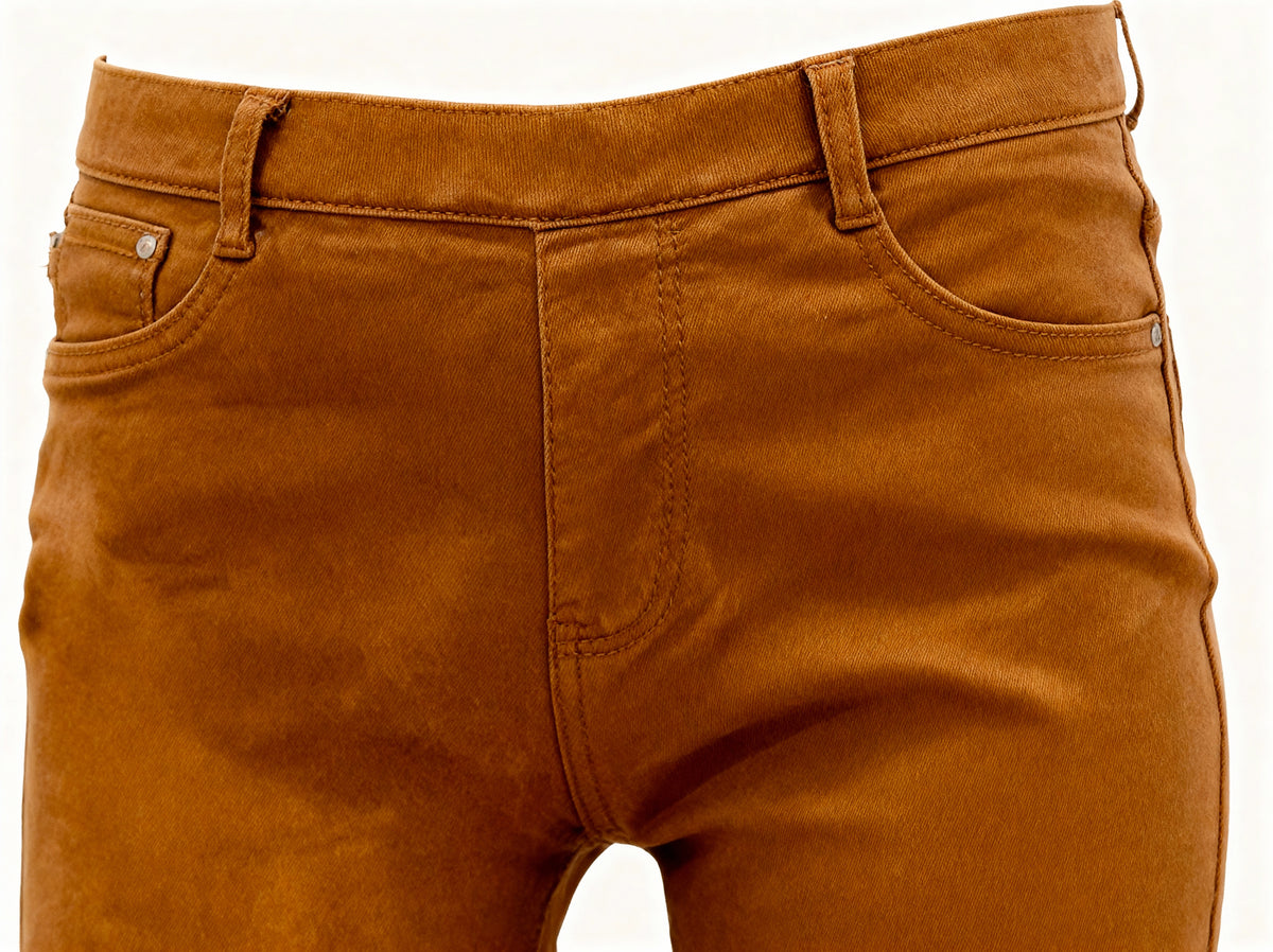 Close-up front view of camel brown body-shaping jeggings on white background,  everyday chic styling