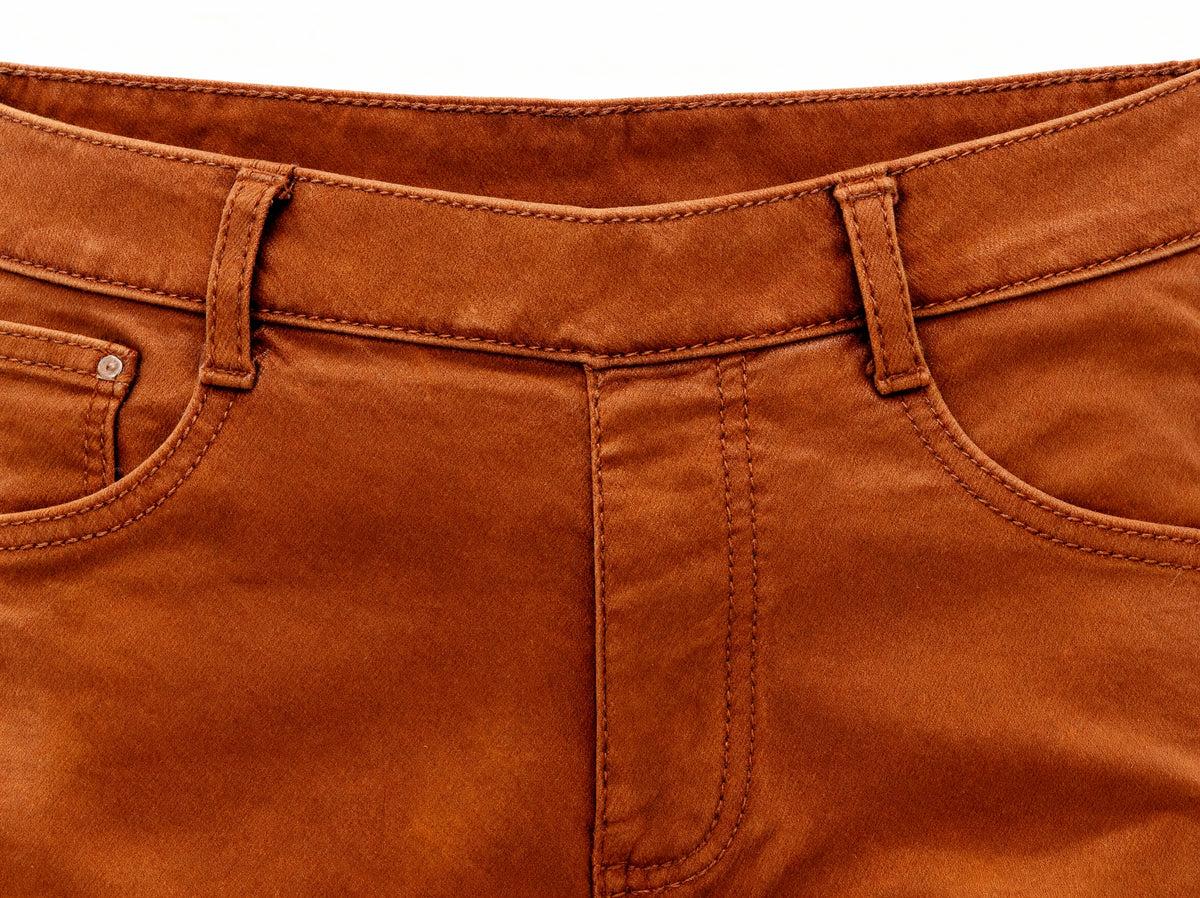 Close-up front view of camel brown body-shaping jeggings on white background, everyday chic styling