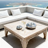 Large silver aluminium ashtray displayed on a Mediterranean terrace table overlooking the sea in Crete.