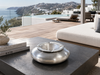 Large 24x24 cm aluminium windproof design ashtray with silver finish, styled in a luxury outdoor lounge in Greece, available at VVC SHOP Sitia Crete.