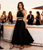 Side view of black macramé halter top with gold bone embellishments, festival or beach outfit available in Sitia
