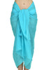 MiandMI sky blue cotton pareo shown in a front-tied studio view, 100 × 180 cm solid-colour beach sarong made in Greece, available at VVC SHOP Sitia, Crete.