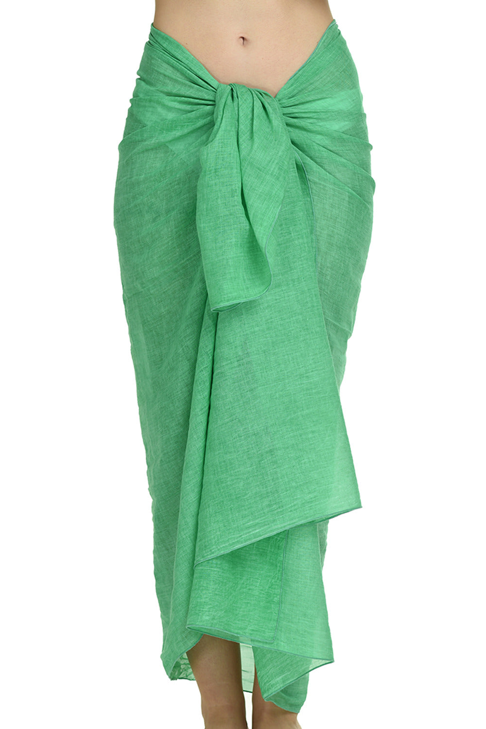 MiandMI spring green cotton pareo shown in a front-tied studio view, 100 × 180 cm solid-colour beach sarong made in Greece, available at VVC SHOP Sitia, Crete.