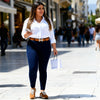 Front view of a woman wearing Miss Sister dark blue body-shaping stretch denim jeggings at VVC Shop Sitia.