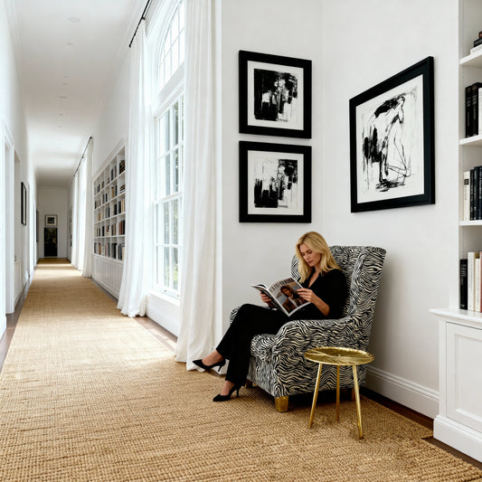 Cowhide zebra accent chair positioned next to coffee table and floor lamp in contemporary home setting