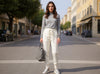 Fine-knit wool jogging trousers in off-white with drawstring waistband, front view