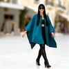 Elegant petrol poncho with black wool-touch embroidery, lightweight polyester, easy-care and stylish Italian design by Michaela MII