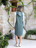 Back view of the Polin sporty hooded midi dress in mint, petrol and ecru with long sleeves and a relaxed silhouette.