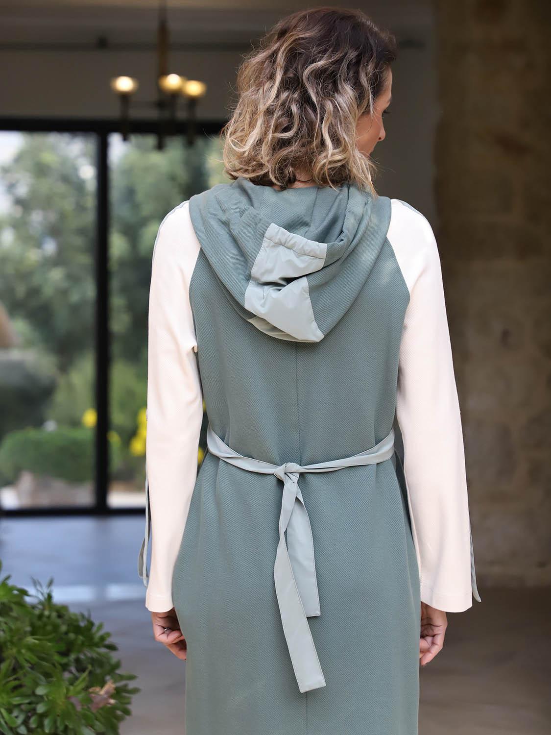 Rear-angle view of the Polin mint, petrol and ecru cotton-blend midi dress showing its hood and relaxed fit.