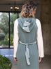 Rear-angle view of the Polin mint, petrol and ecru cotton-blend midi dress showing its hood and relaxed fit.
