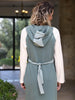 Rear angle of sporty hooded cotton blend midi dress showcasing relaxed fit and hood detail.