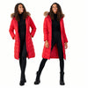 Woman wearing a red puffer coat with fur hood on a white background