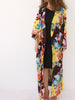 Model side pose flowing silk kimono VVC beach to evening style