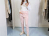 Soft pink knitted wool lounge trousers with elastic waistband, front view
