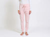 Studio front view of pink slim-fit fine-knit wool jogger trousers with an elastic drawstring waistband.