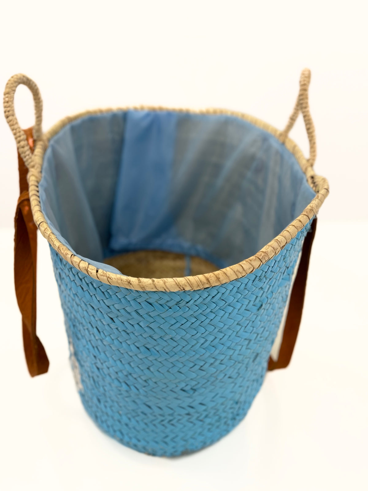Interior view of the handmade VVC™ anchor basket showing spacious storage capacity, woven palm leaf construction and practical design for beach, shopping and travel use.