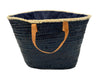 Back view of handmade VVC™ nautical beach basket with natural woven palm leaf finish and leather handles. Mediterranean shopping tote and beach bag available at the VVC Shop in Sitia, Crete.
