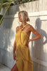 Decorative pompom trim and hip strip detail on Athena maxi dress, made in Greece