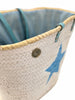 Interior detail of large handmade beach basket with protective lining and spacious storage for beach essentials