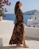 Lifestyle side view of VVC black floral Italian silk kimono made from Dolce & Gabbana fabric, styled as luxury resortwear by VVC SHOP Sitia