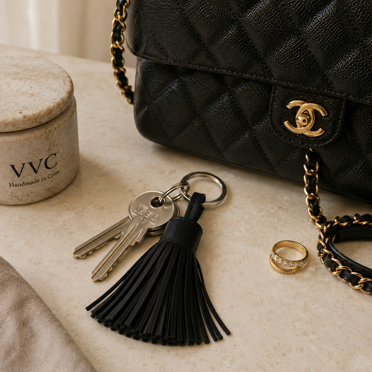 VVC black leather tassel key chain handmade in Crete from leftover genuine leather, styled with keys and handbag at VVC SHOP Sitia