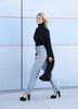 Side view of the VVC™ black longline blazer with a classic tailored cut, made in Greece.