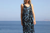 Front view of the VVC blue-and-black mullet dress showing its floral sequin embroidery and sleeveless fitted bodice.