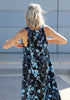 Back close-up of the VVC blue-and-black floral sequin mullet dress showing its tulle overlay and embroidered pattern.