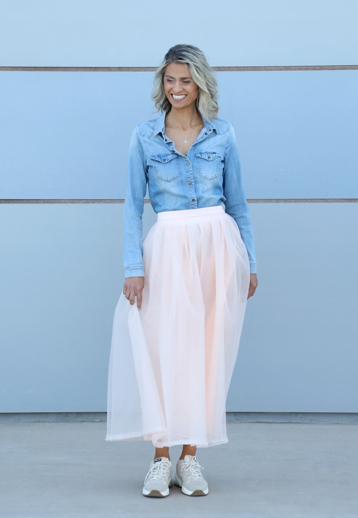 Blue shirt styled with VVC soft peach tulle skirt, elegant wedding guest look and special event outfit in Crete