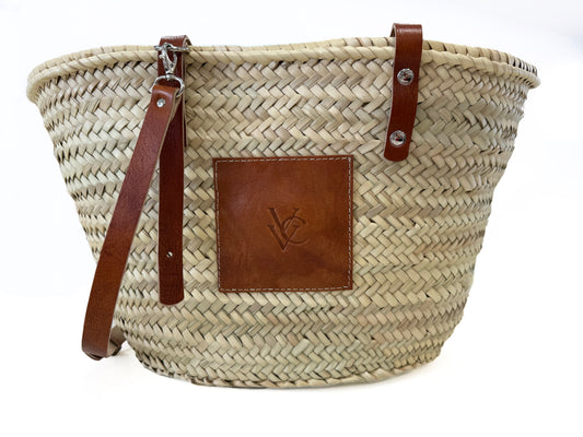 Handmade VVC™ crossbody palm leaf basket with brown leather strap and leather pocket. Lightweight shopping bag, beach tote and travel basket available in Sitia, Crete and online.