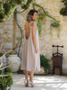 Back view of the VVC Flowing Blush Low-Back Midi Dress showing the deep scoop back, metallic shoulder straps and flowing A-line silhouette, made in Greece.