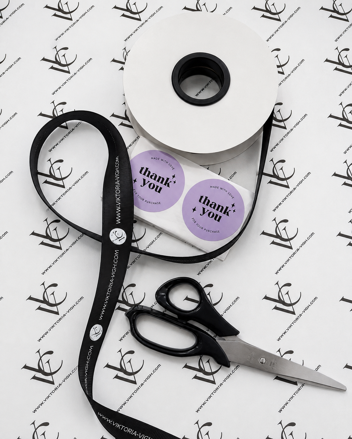 VVC branded gift wrapping paper with black ribbon, thank you stickers and packaging details for premium gift service at VVC SHOP Sitia, Crete.