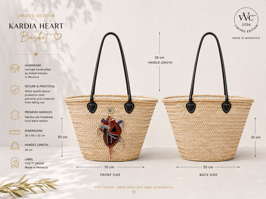 Front and back view of the VVC™ Kardia Heart Basket handmade in Morocco. Natural raffia basket with black leather handles, rhinestone heart applique, protective textile lining and artisan craftsmanship for beach, shopping and everyday use.