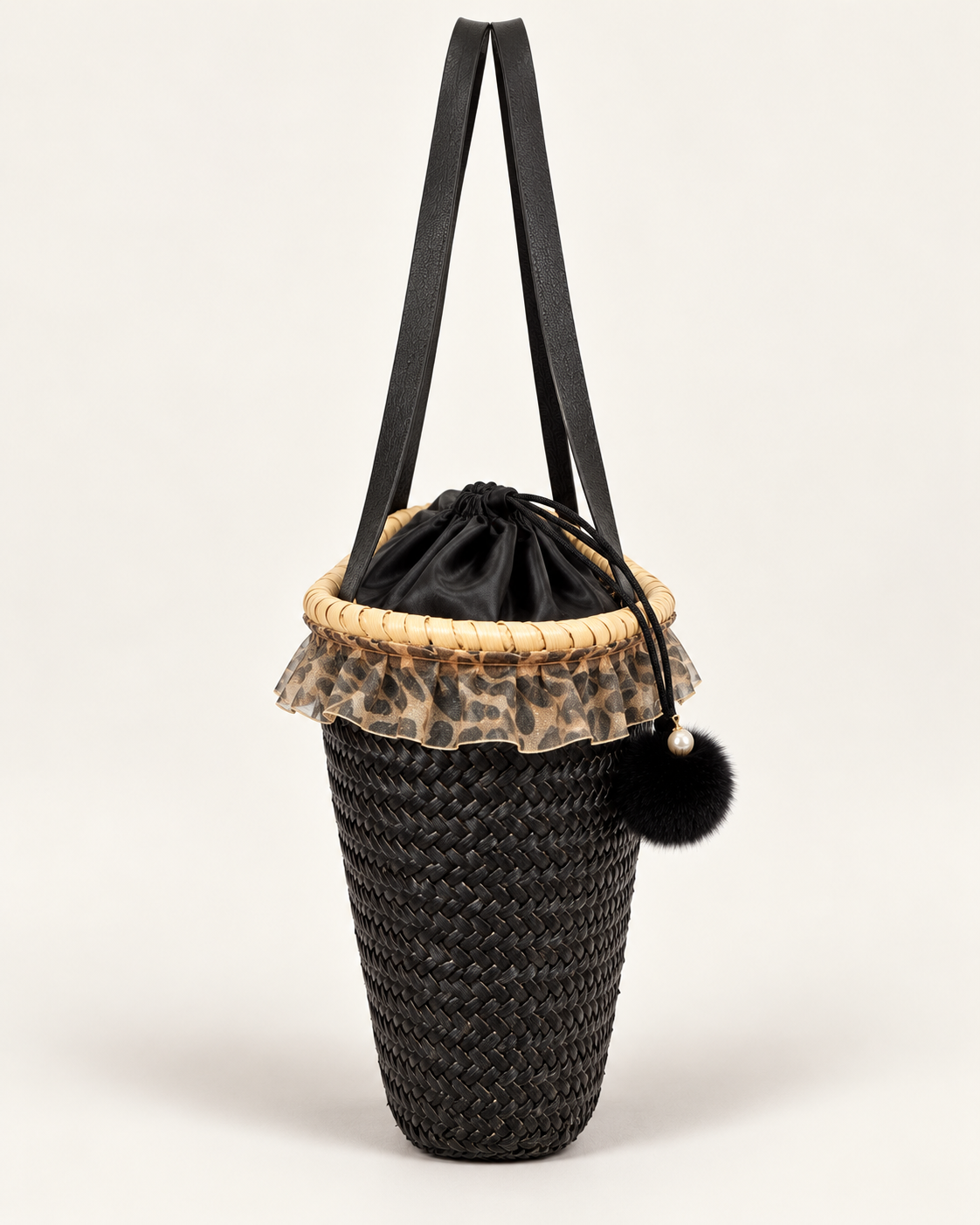 Side view of VVC™ large black raffia basket bag with leopard-print drawstring lining