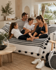 VVC black and white organic cotton blanket handmade in Morocco, used as a cozy home lifestyle throw for family moments, available in Sitia Crete and online