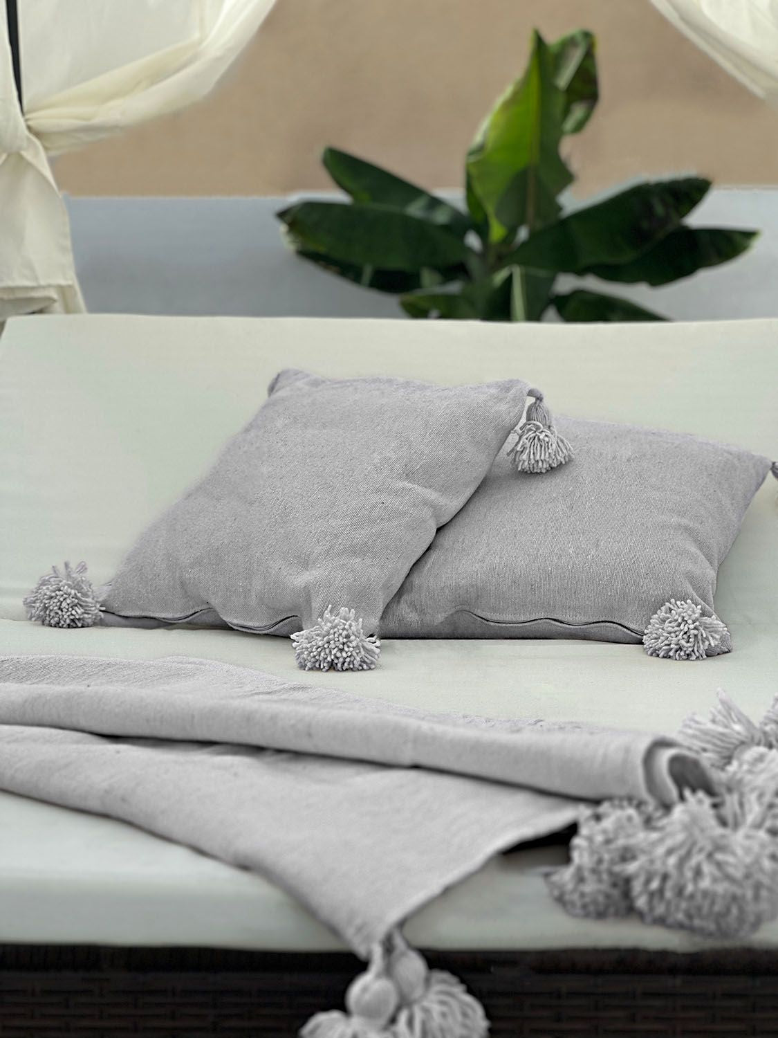 light gray close up organic cotton blanket, showcasing handmade quality and natural fibers.