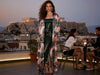 Woman wearing the VVC pink animal print long silk kimono cardigan for an elegant evening in Greece